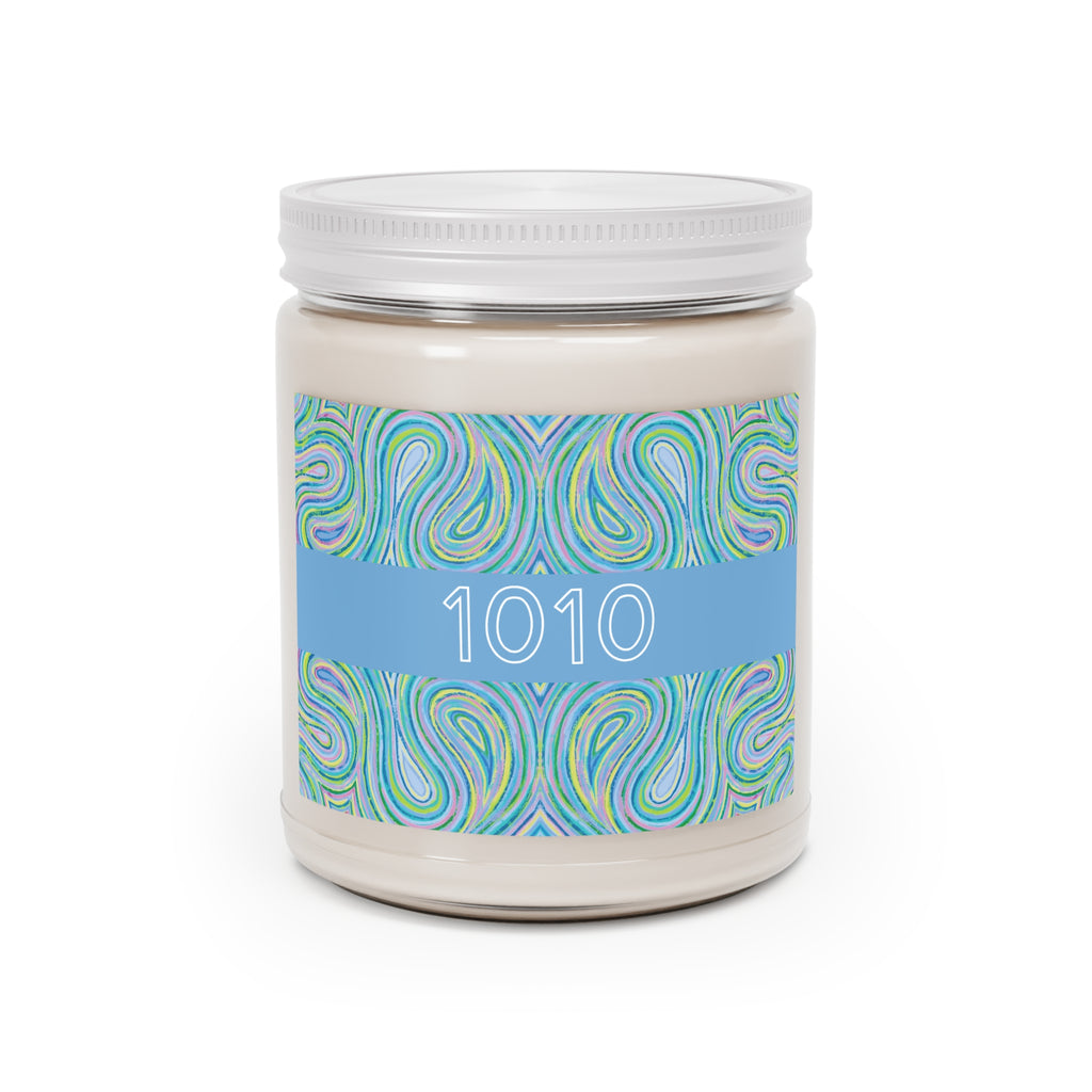  1010 angel number soy candle with lid, featuring Eden chakra art