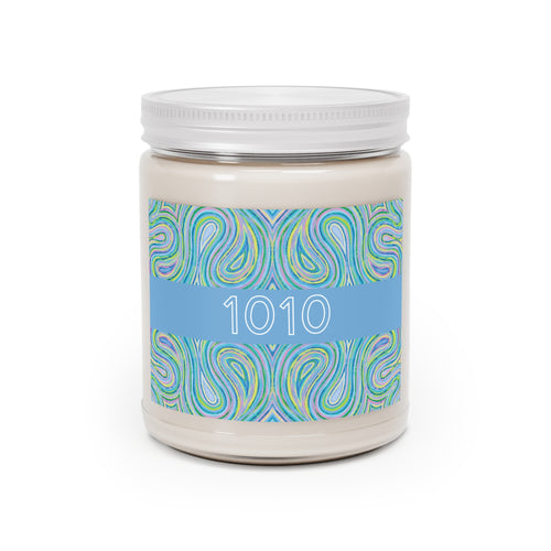  1010 angel number soy candle with lid, featuring Eden chakra art