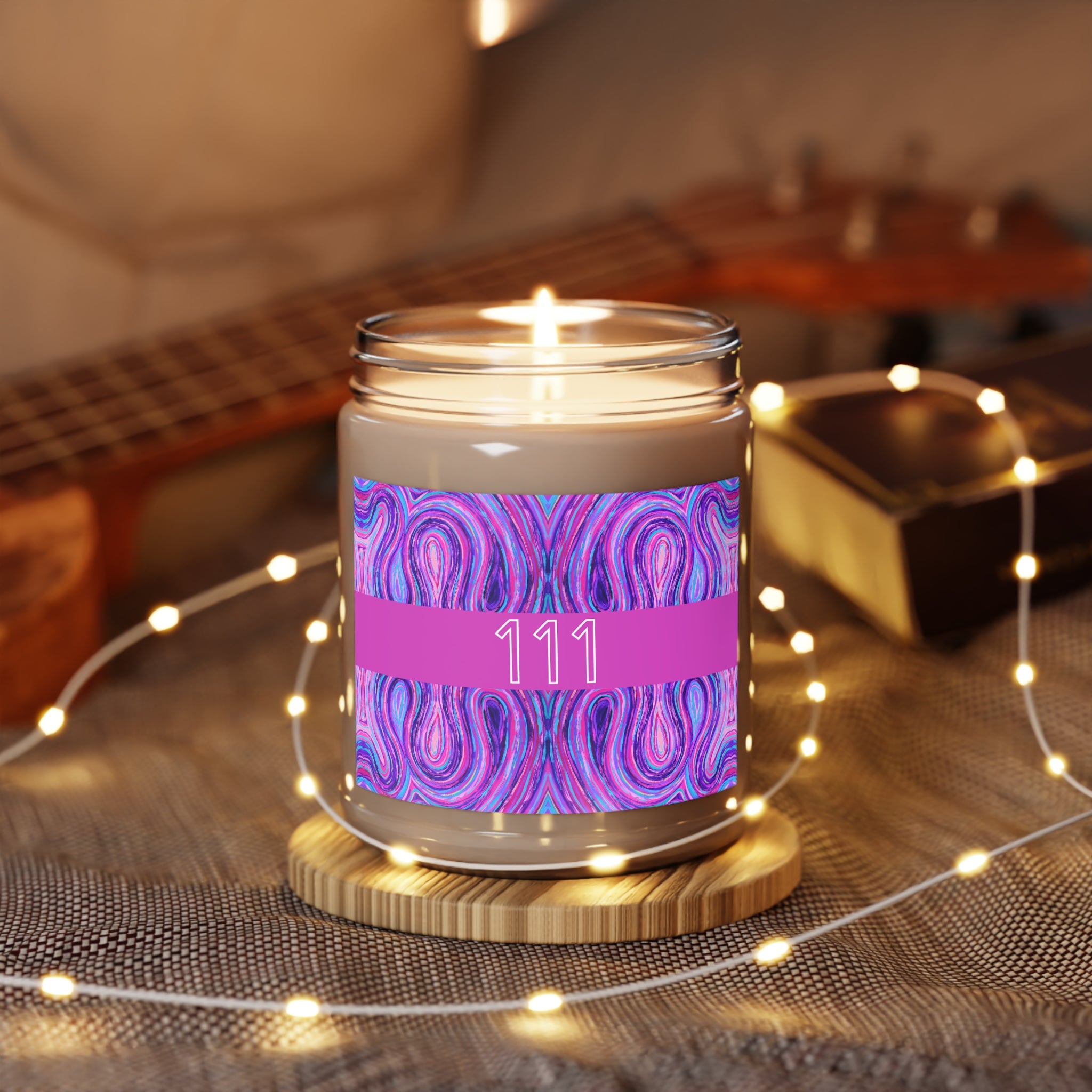  111 angel number candle surrounded by twinkle string lights
