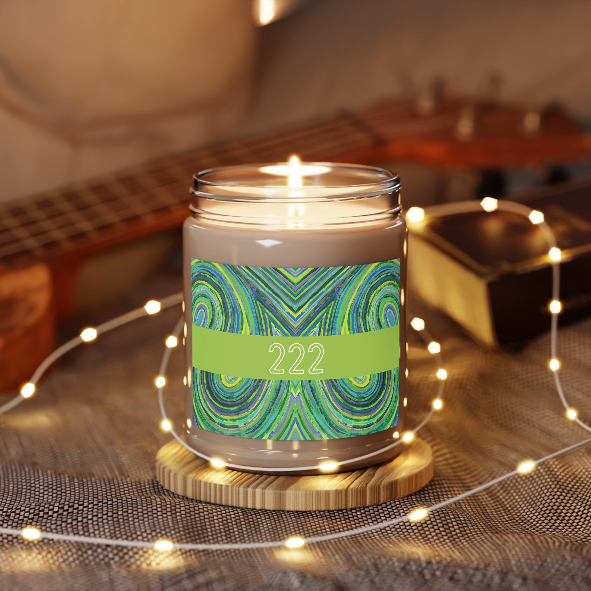  222 angel number candle surrounded by twinkle string lights
