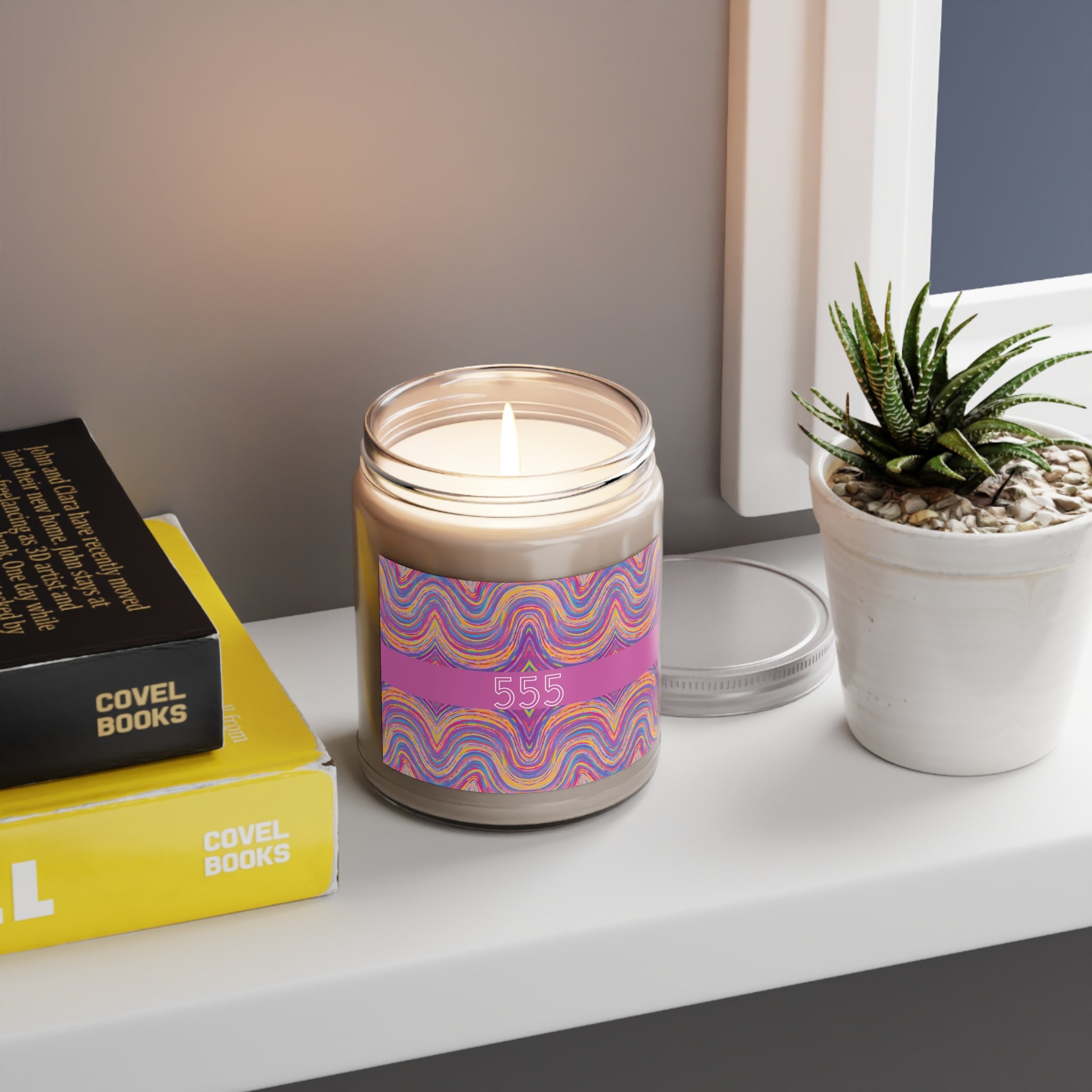  555 angel number candle styled on a shelf