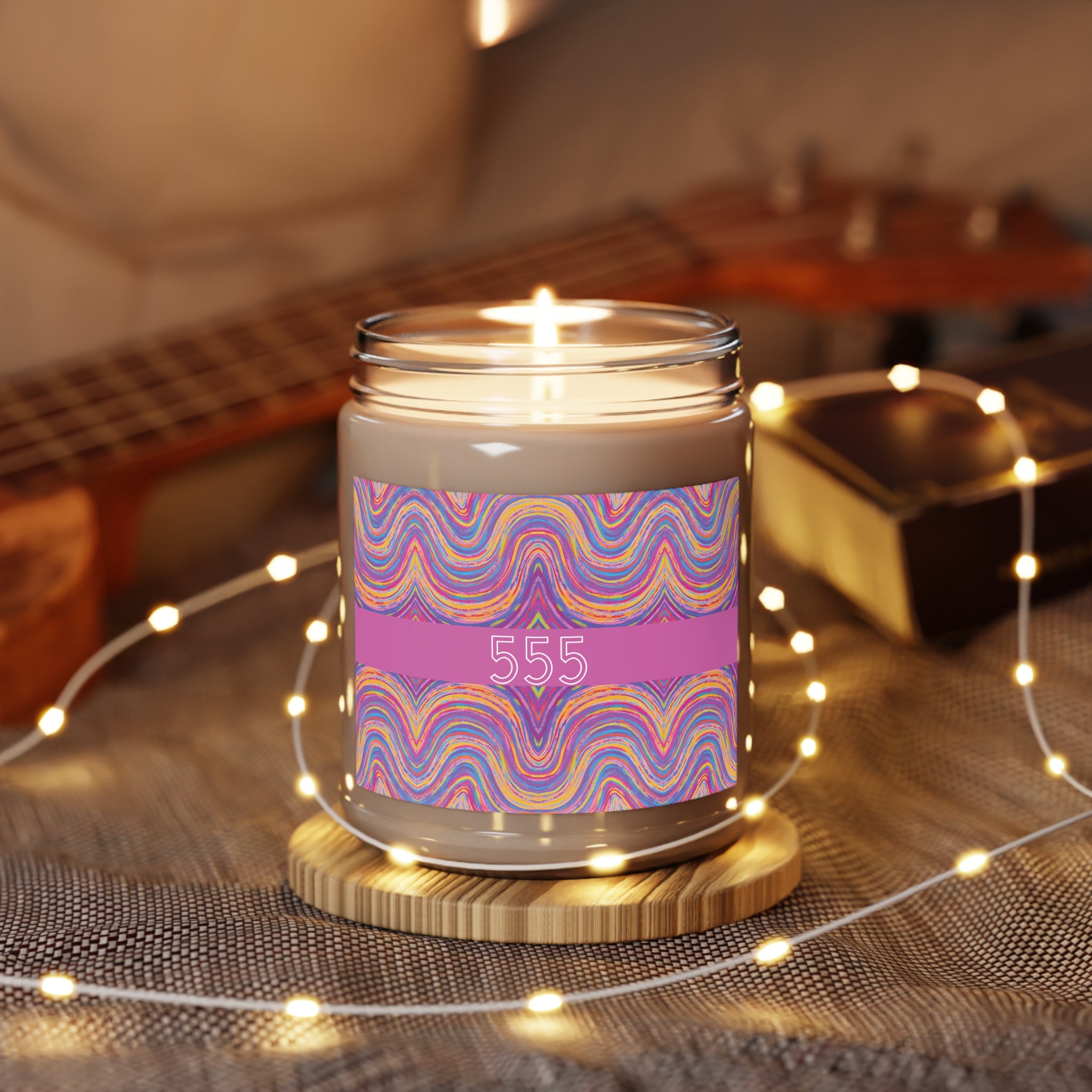  555 angel number candle surrounded by twinkle string lights